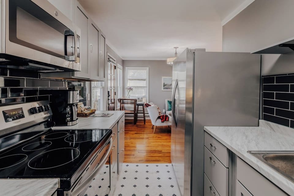 house 1 kitchen, just renovated with frig, stove. microwave. cook top and fully stocked with cookingware