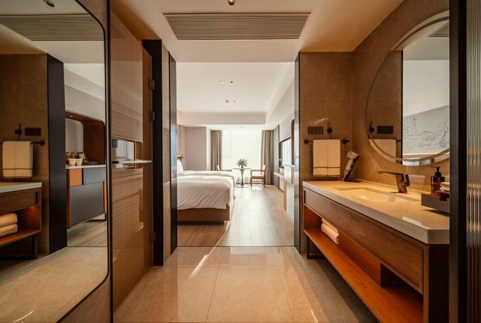 Superior Twin | Bathroom | Designer toiletries, hair dryer, slippers, towels