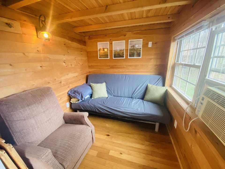 Experience the inviting charm of an open and cozy floor plan that effortlessly connects the kitchen and living area, where you can savor breathtaking views of the lake.