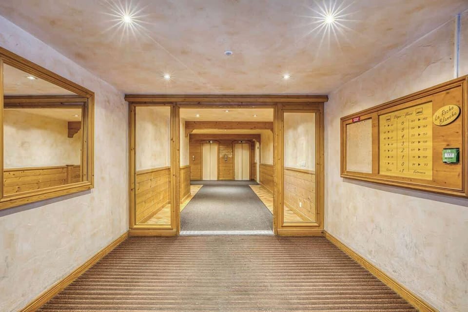 Bright Entrance of La Roche Blanche Residence, calm and familial building.