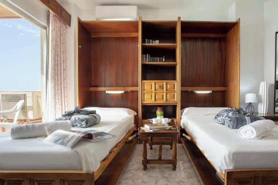 2 single beds in the living room.