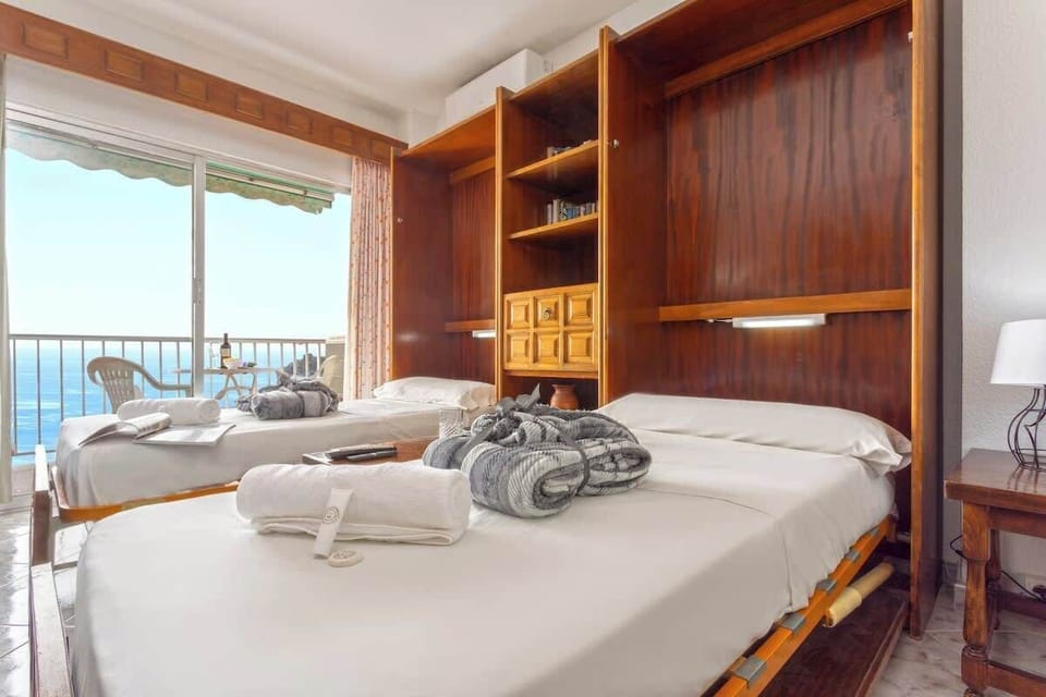 2 single bed in the living room, comfy and practical.