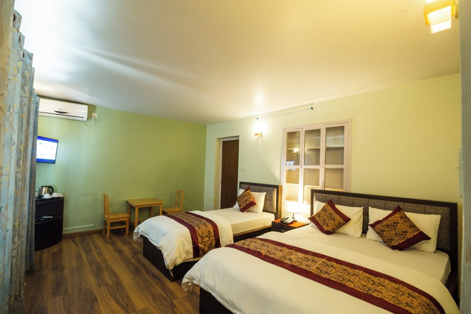 A/C Deluxe Room with 1 Single Bed and 1 Double Master Bed | Hypo-allergenic bedding, desk, free WiFi, bed sheets