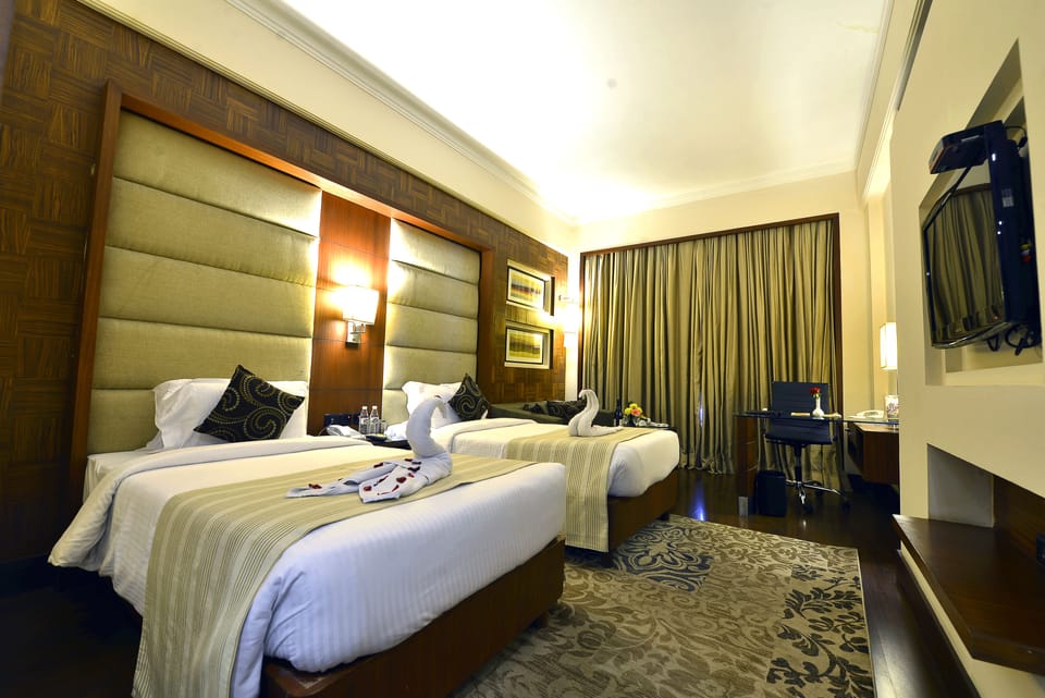Premium bedding, Select Comfort beds, free minibar items, in-room safe