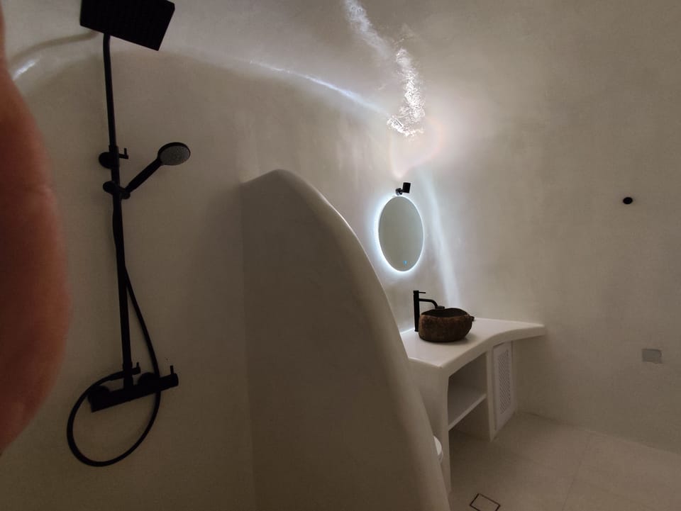 Shower, rainfall showerhead, hair dryer, towels