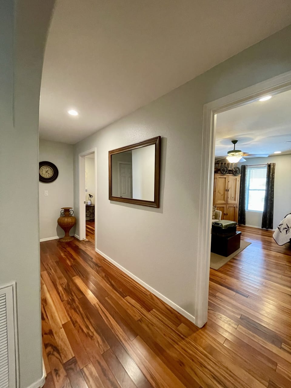 Guest wing hallway leads to guest rooms and guest bath