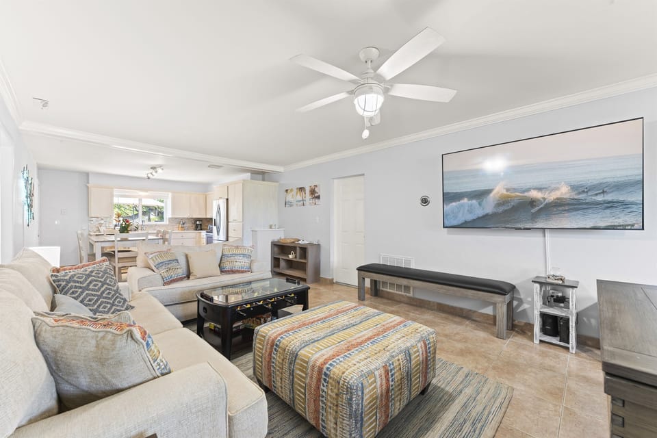 Open floor plan with living room, kitchen, and dining areas