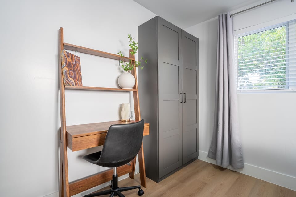 A dedicated workspace for travelers who are working on the go, in bedroom five.