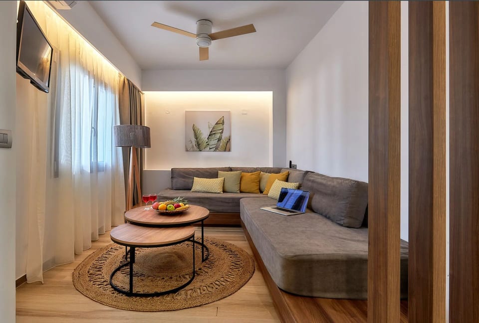 Superior Suite 1 Bedroom Garden View | Living area | 32-inch flat-screen TV with satellite channels, TV