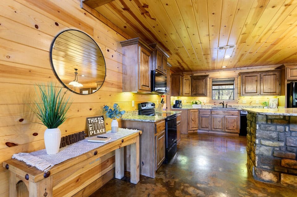A second angle on the kitchen — warm cabinetry, ample counter space, and easy room to move while two cooks work.