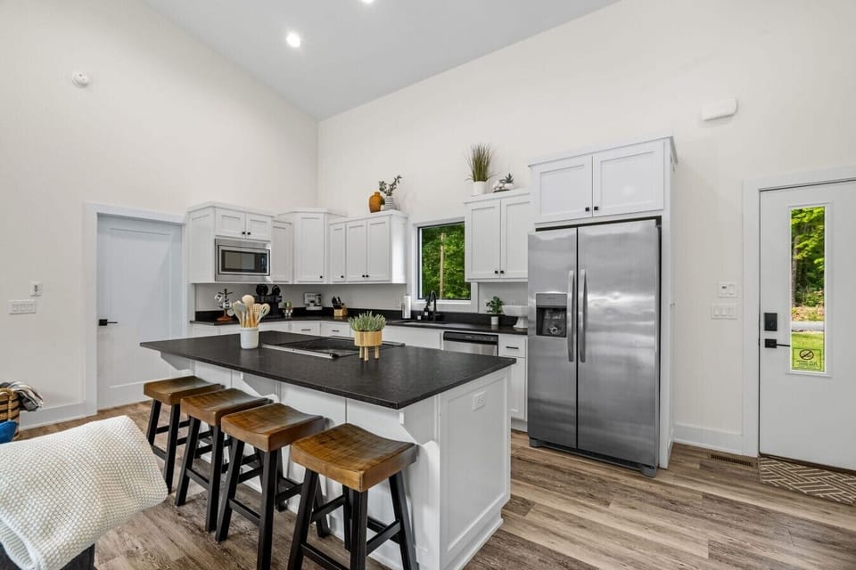 Modern kitchen with island & stainless appliances