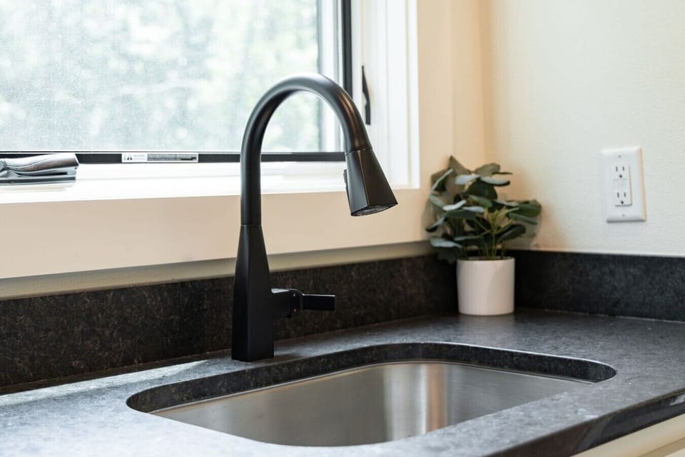 Modern kitchen sink & fixtures — Bella Vista rental