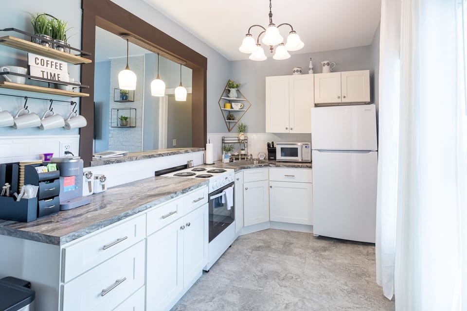 Fully equipped kitchen with keurig coffee maker with flavored coffees, teas.