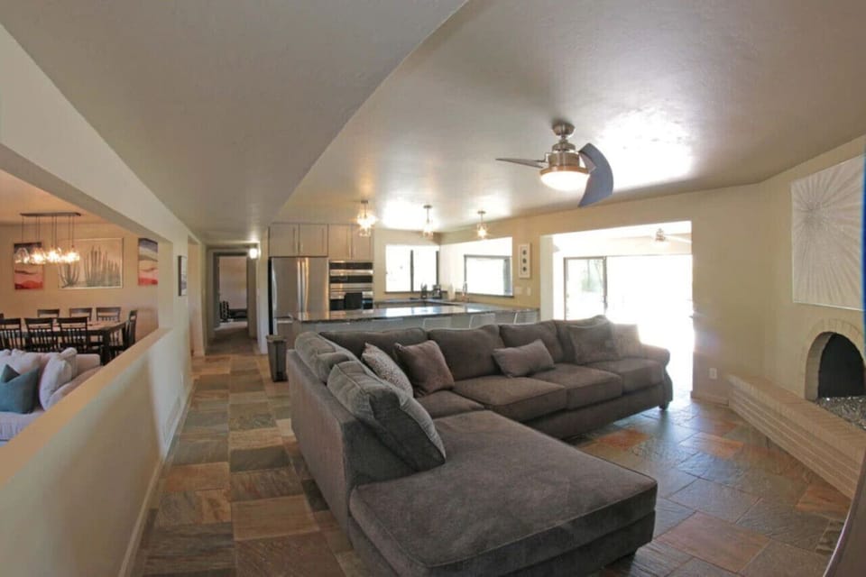 Great room, just off the kitchen, with cozy seating and fireplace