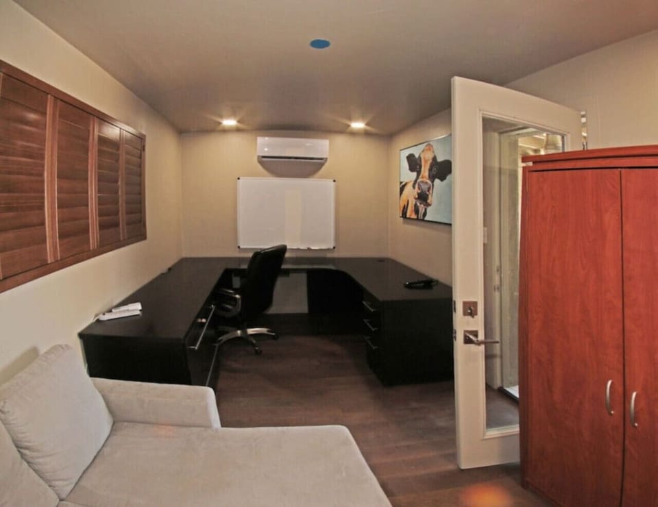 Office with large desk providing private, dedicated workspace