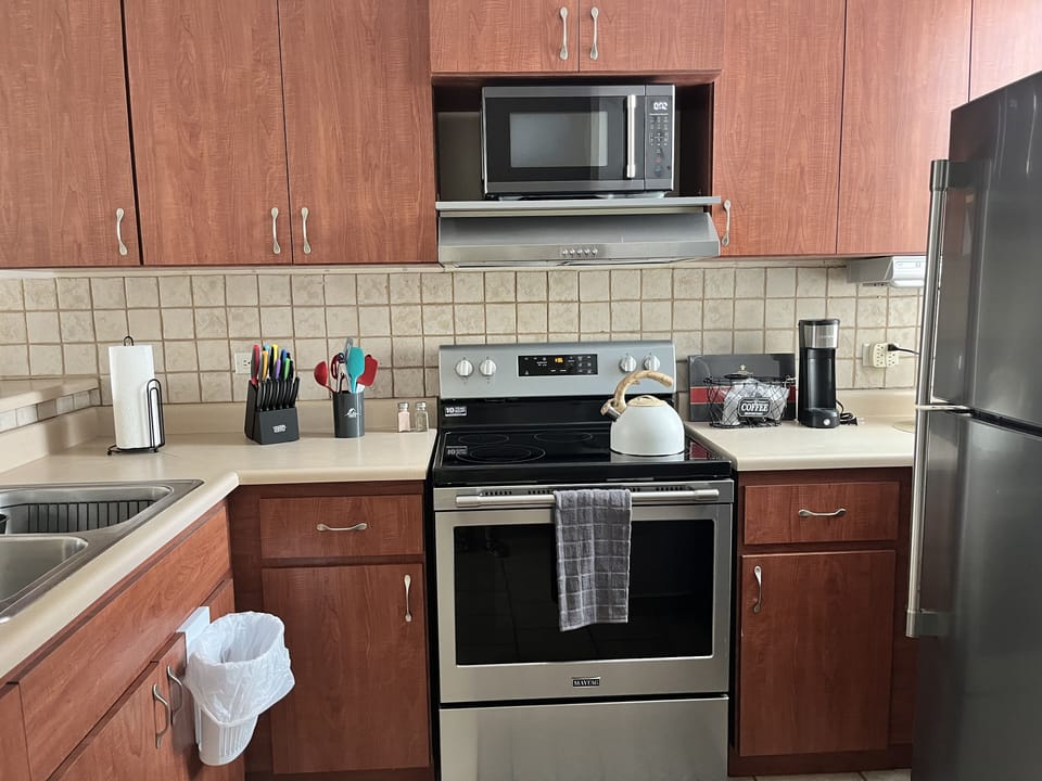Full kitchen that is open to the living room and dining room.