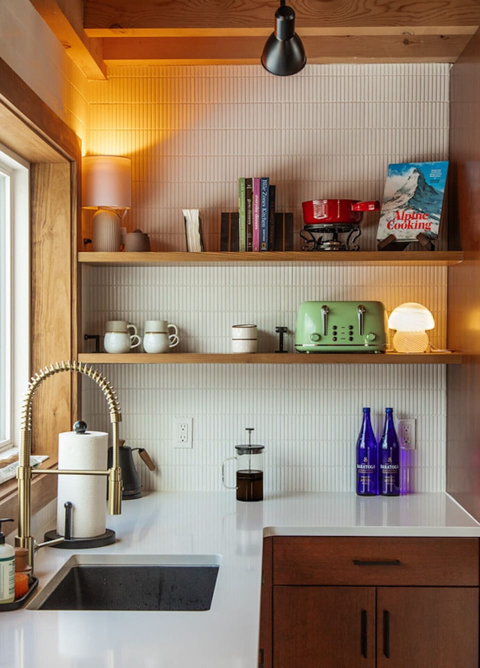 Fully stocked kitchen with Nespresso machine and French press.