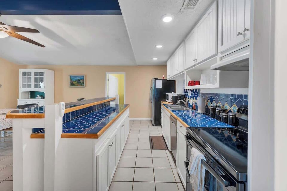 The large kitchen island opens up into the dining room for plenty of seating.