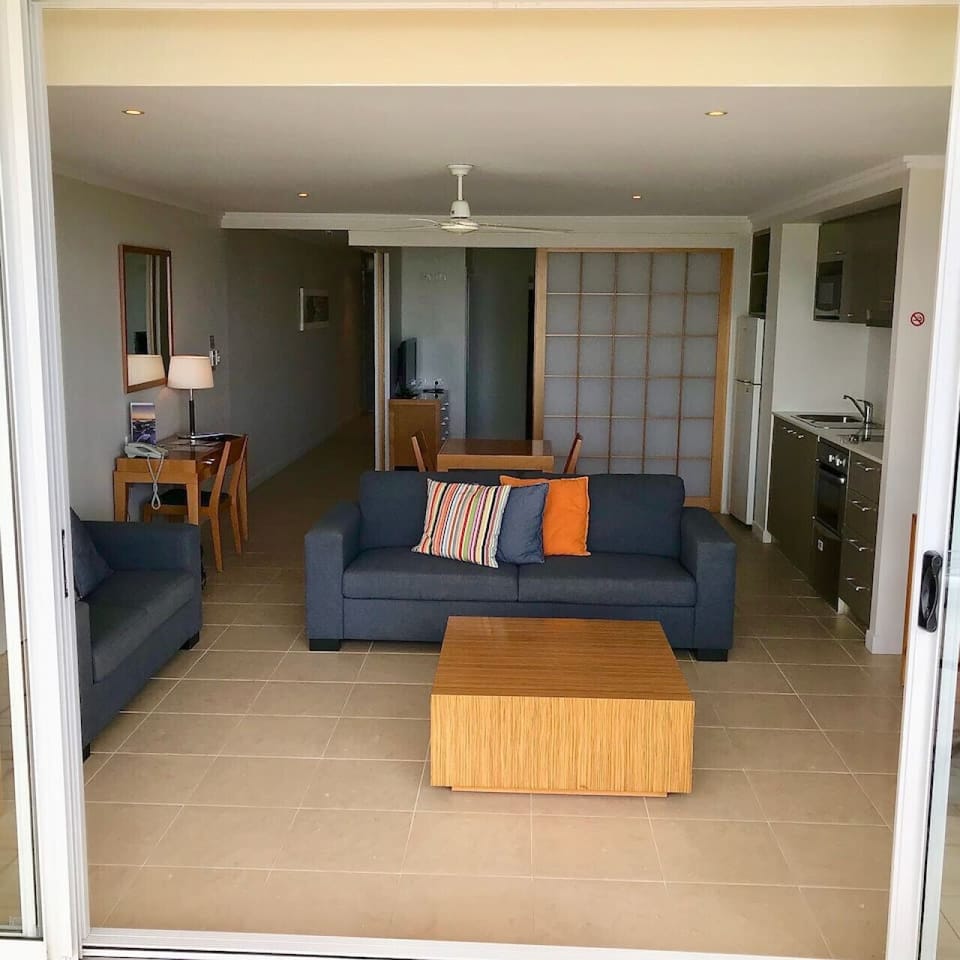 Inviting living space with direct access to the balcony and serene ocean views