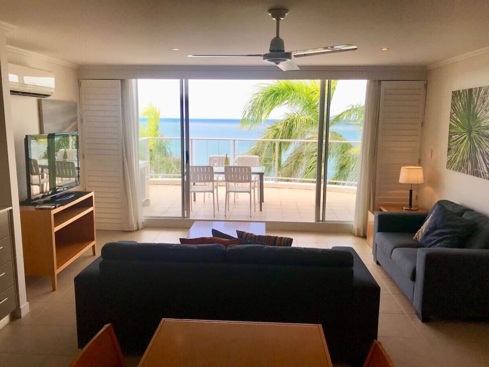 Inviting living space with direct access to the balcony and serene ocean views