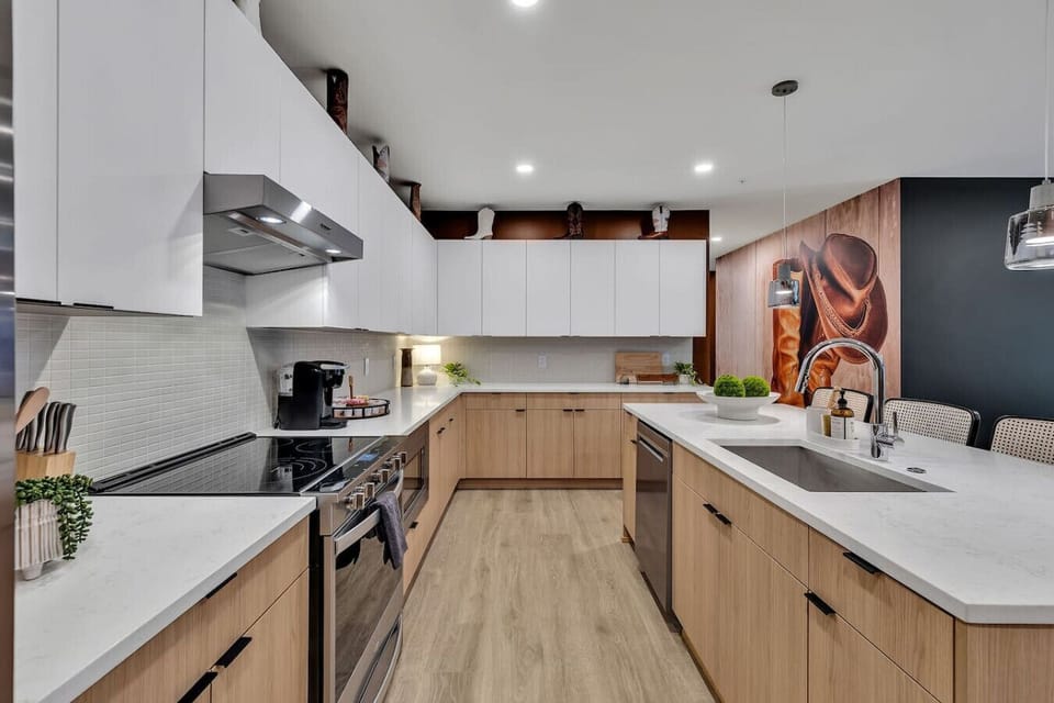 Fully stocked kitchen with stainless steel appliances and everything you`d need to make a home cooked meal