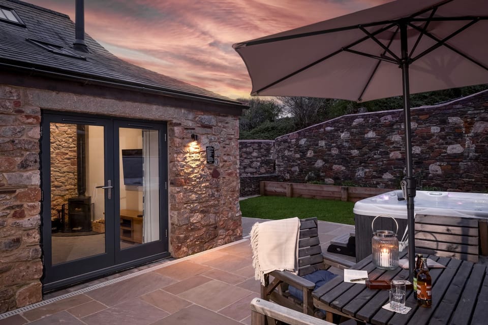 Outside patio area, wit hot tub, parasol and access to property - The Dairy