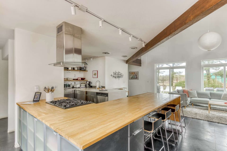 Entertain with ease! This open kitchen flows into the living area, perfect for socializing while cooking. 
