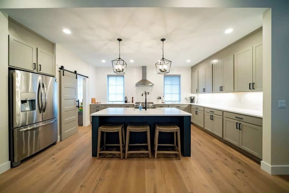 The spacious gourmet kitchen is outfitted with all top-of-the-line stainless steel appliance.