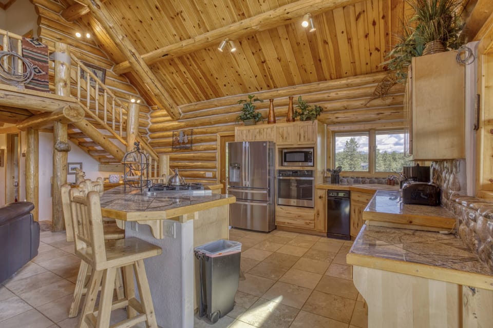 This fully equipped kitchen is open to the main floor dining and living space. This home features a fantastic layout for large gatherings. Sleeps 12!