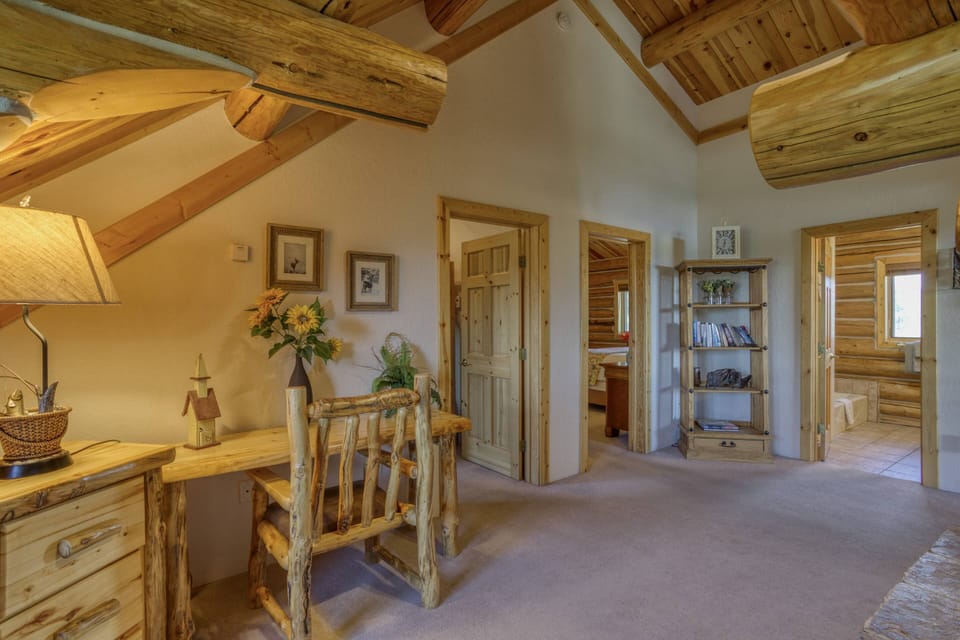 As you enter the second floor, you have a quiet work area, two bedrooms, a full shared bath and another fireplace-Room for everyone to spread out in!