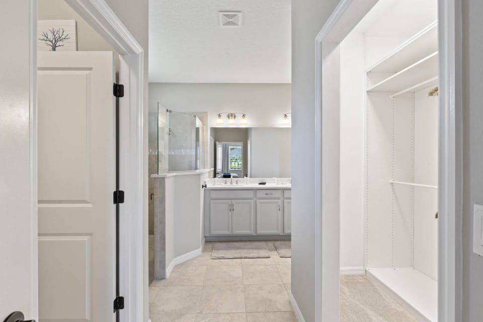 Master bath with dual walk-in closets, offering both luxury and convenience.