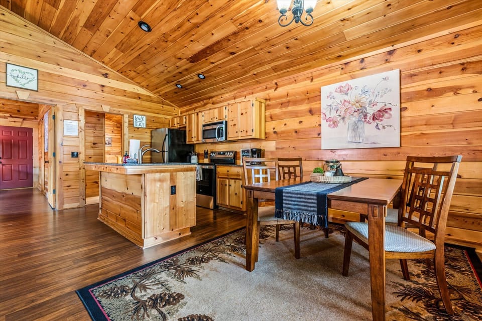 A fully equipped kitchen with island seating flows right into the dining nook — cook, eat, and connect all in one open space.