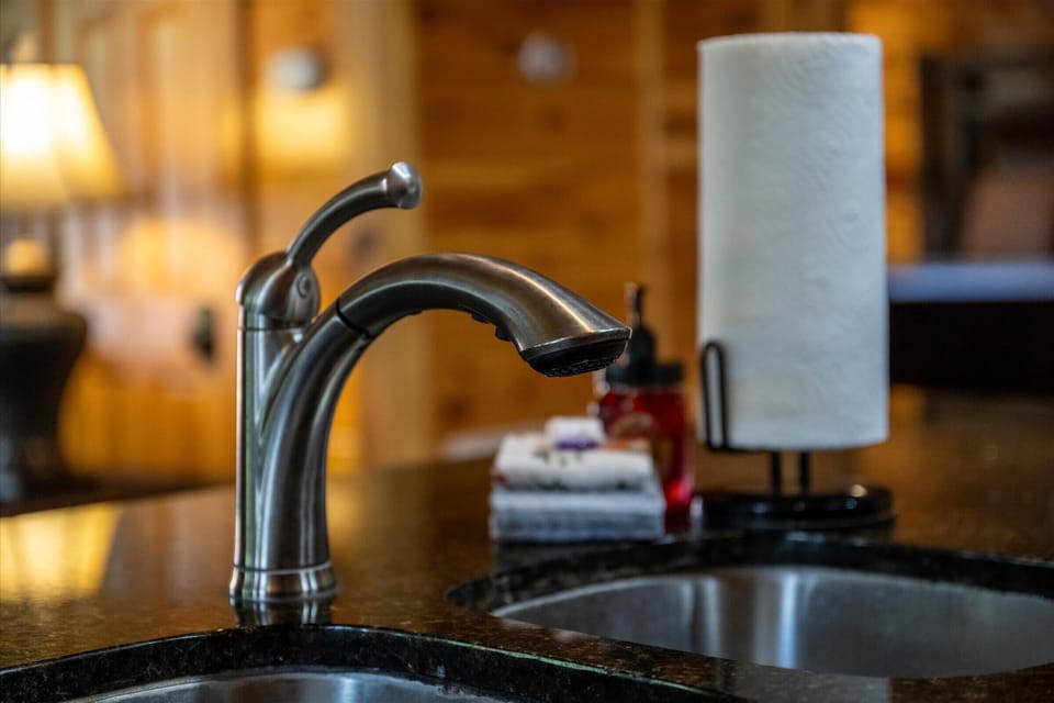 A sleek pull-down faucet and full prep counter make cooking here quick and easy.