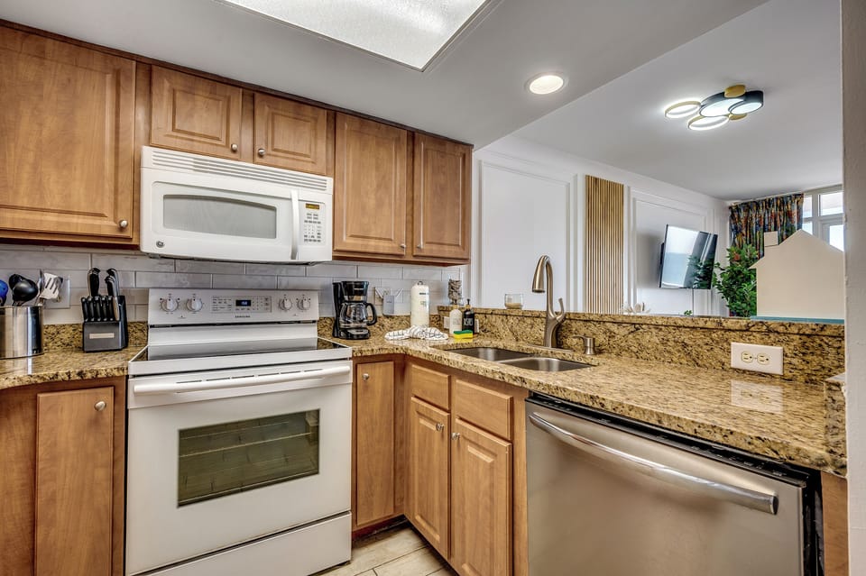 A modern kitchen with sleek appliances and a clean design.