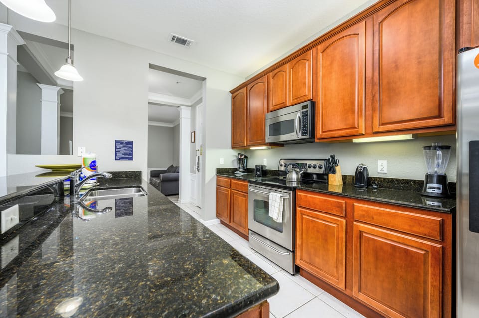 Condo (Beautiful Lake View Condo, Vista Cay-) | Private kitchen | Cookware/dishes/utensils