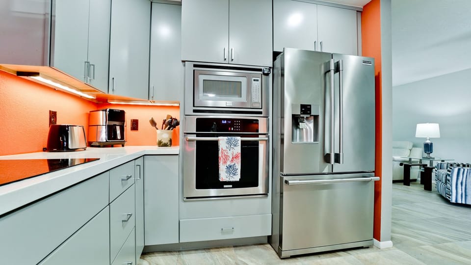 Stainless steel appliances in modern kitchen.