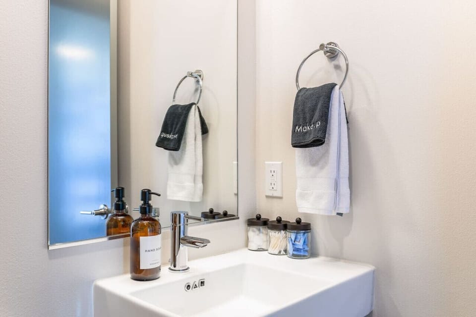 A clean, well-stocked vanity with quality products — we believe in quality details.