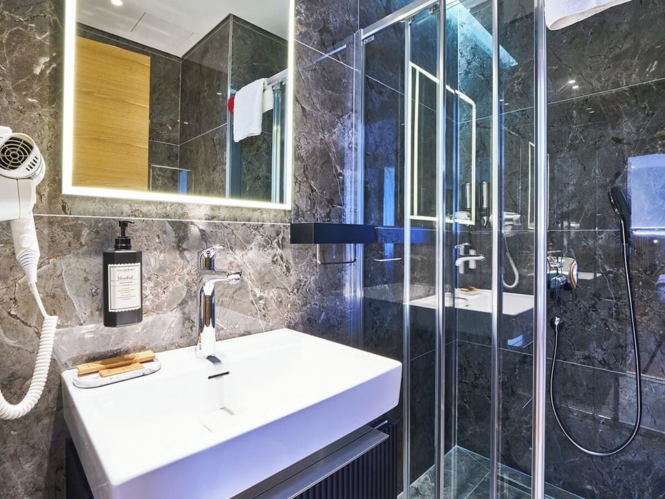 Shower, rainfall showerhead, eco-friendly toiletries, hair dryer