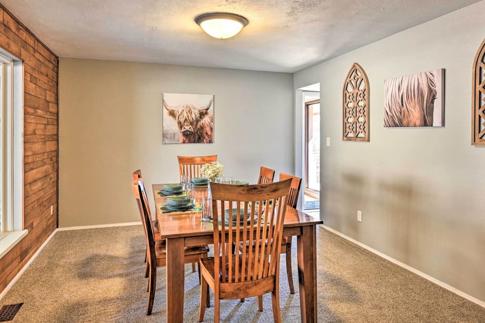 Charmingly lit dining space: Gather & feast at our wooden table!