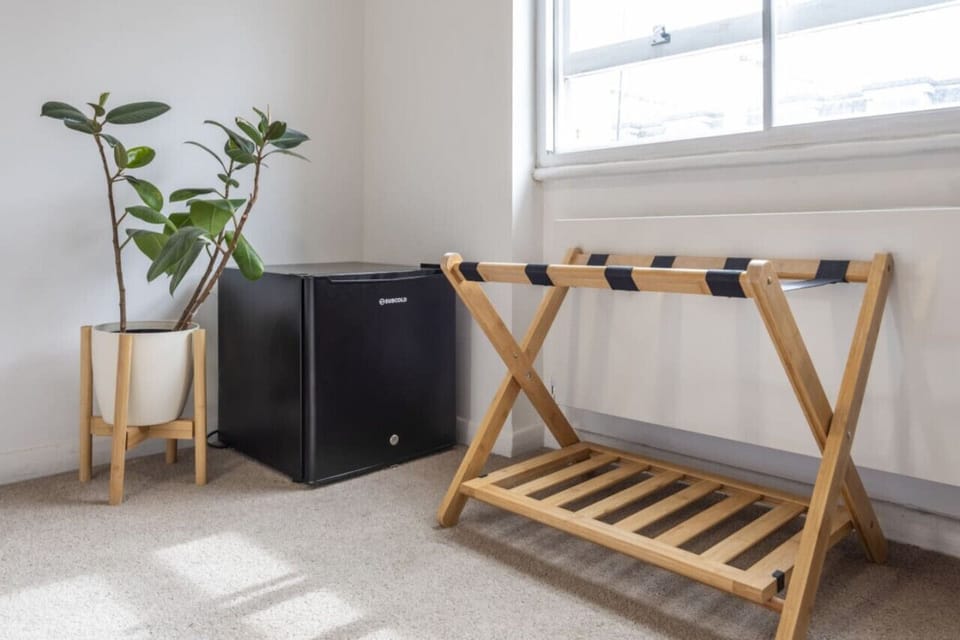 Mini fridge to keep your beverage and luggage rack so it's easier to access your stuff from your luggage. cool and luggage