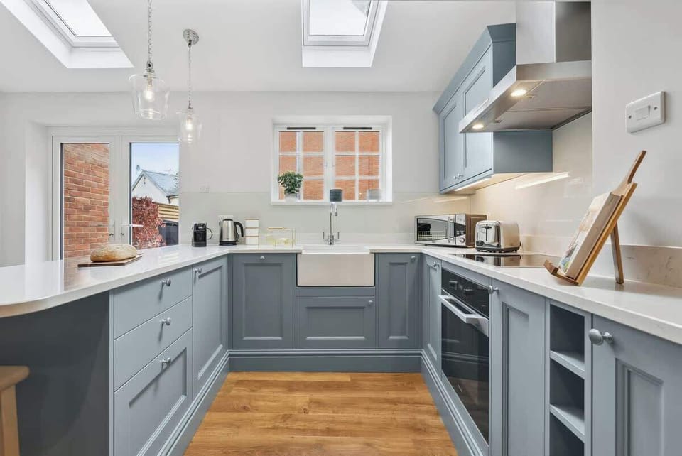 Whip up a home-cooked meal with family in the fully equipped kitchen and dining area at Blue Puffin Stays  Short Lets & Serviced Accommodation