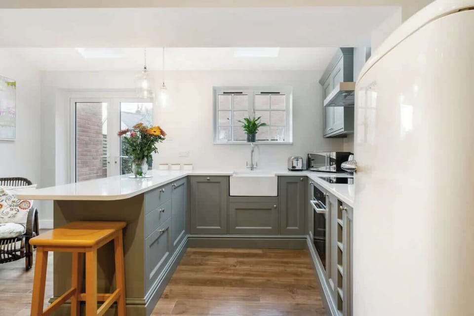 Whip up a home-cooked meal with family in the fully equipped kitchen and dining area at Blue Puffin Stays  Short Lets & Serviced Accommodation