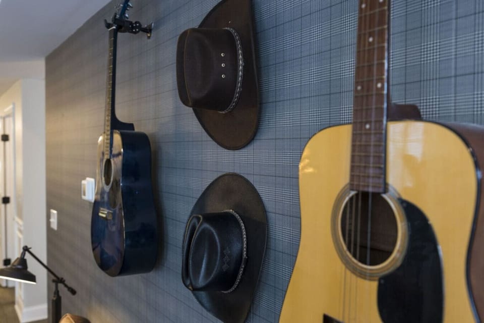 Nashville flair shines through with cowboy hats and a guitar on display.