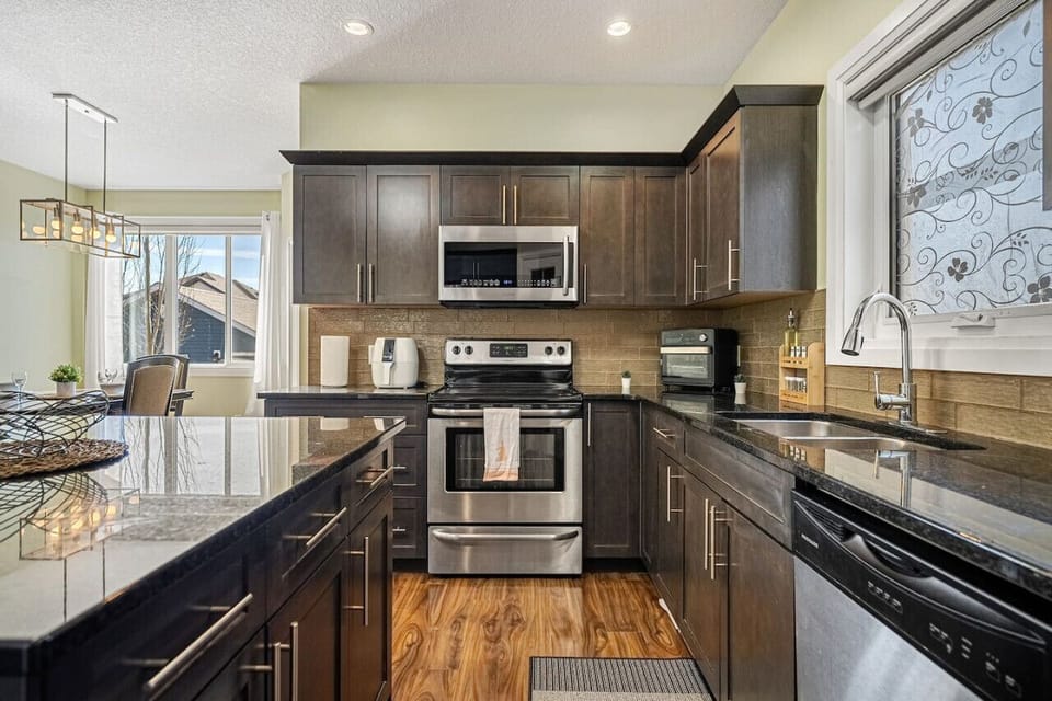 Fully-equipped kitchen, boasting a Air Fryer, modern appliances, and a coffee machine for your morning brew.