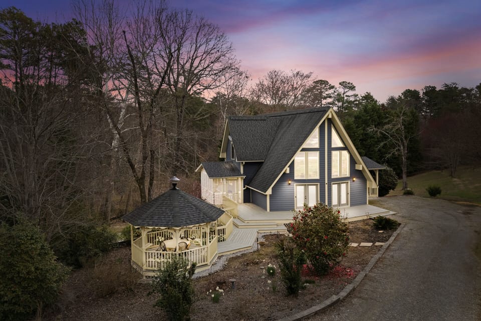 Beautiful A-Frame design with gazebo and screened porch for outdoor enjoyment.