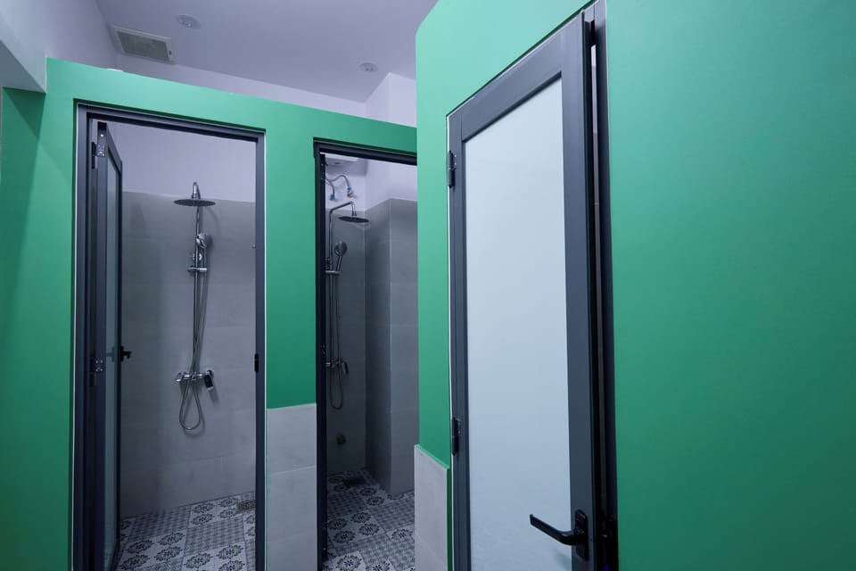 Standard Shared Dormitory, Multiple Beds, Non Smoking, City View | Bathroom | Shower, rainfall showerhead, slippers, towels