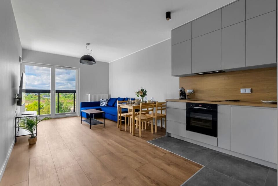 Comfortable Living Room with Sofa Bed and Smart TV | Book Now with RENTUJEMY