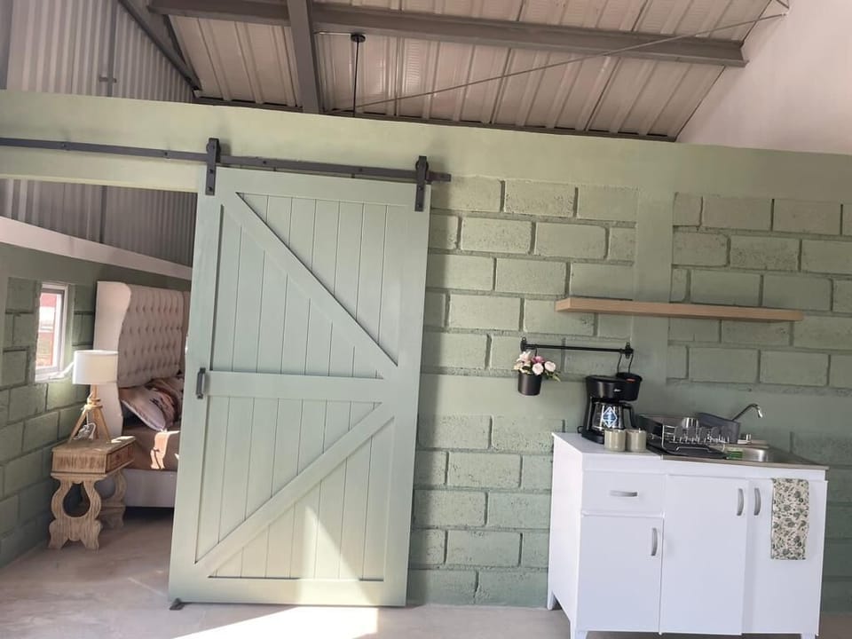 Deluxe Cabin | Private kitchen | Coffee/tea maker, mini-fridge, microwave, cookware/dishes/utensils