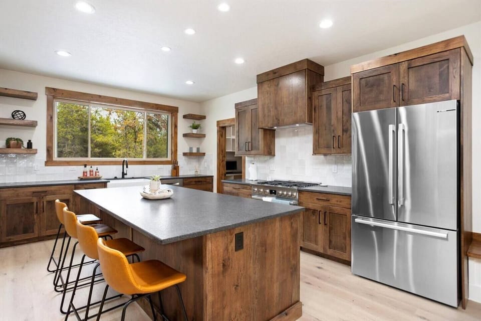 Natural wood cabinets and earthy tones make this kitchen feel cozy and inviting