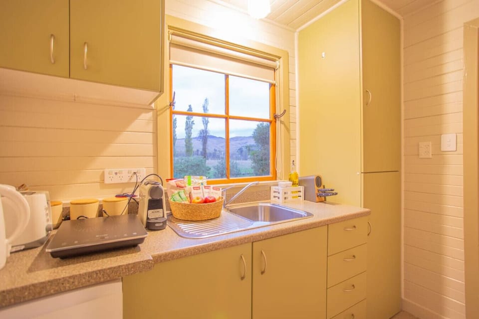 Prepare your morning coffee while gazing out at rolling hills through your kitchen window.